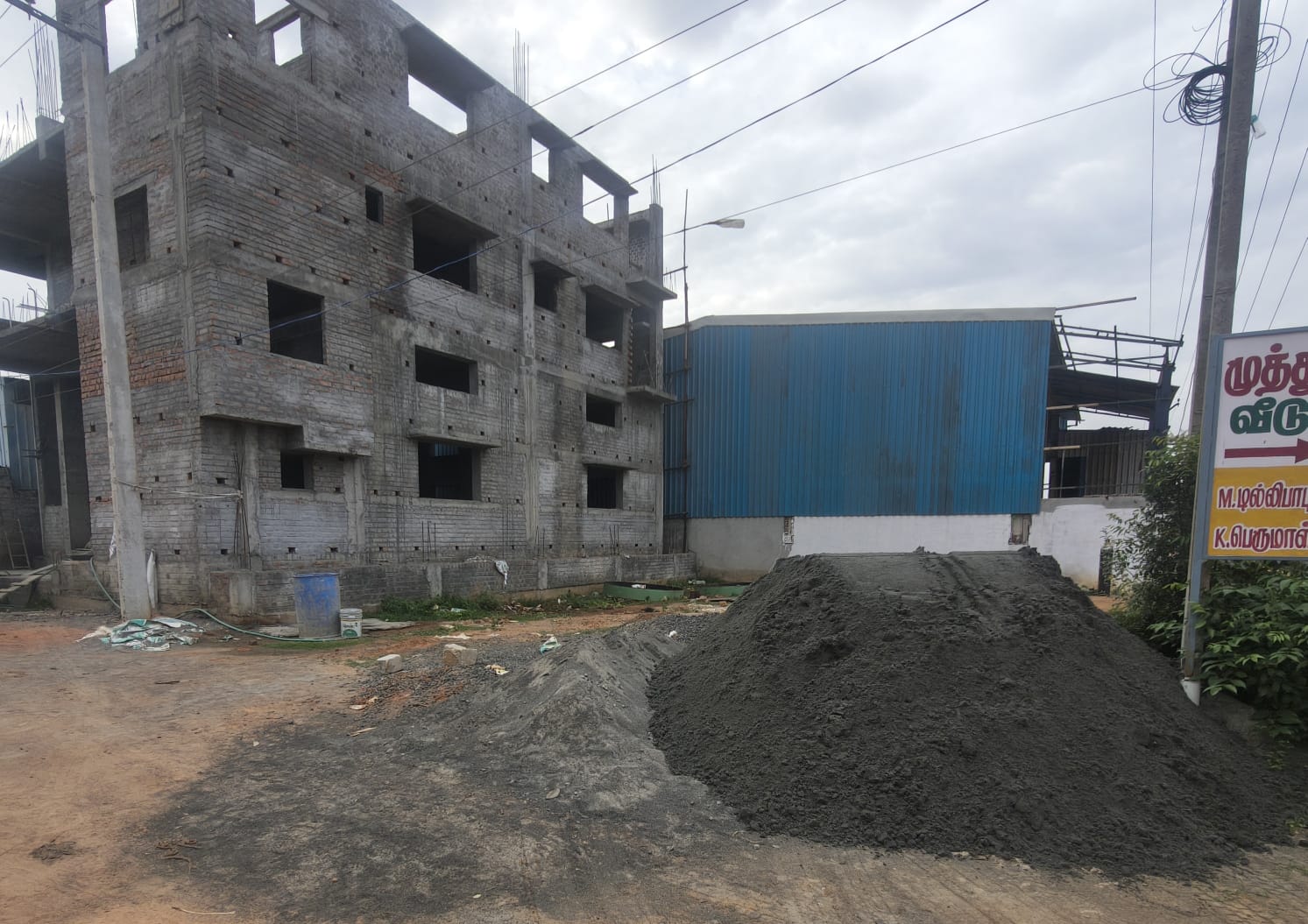 Sand and aggregate delivery at a Chennai building site