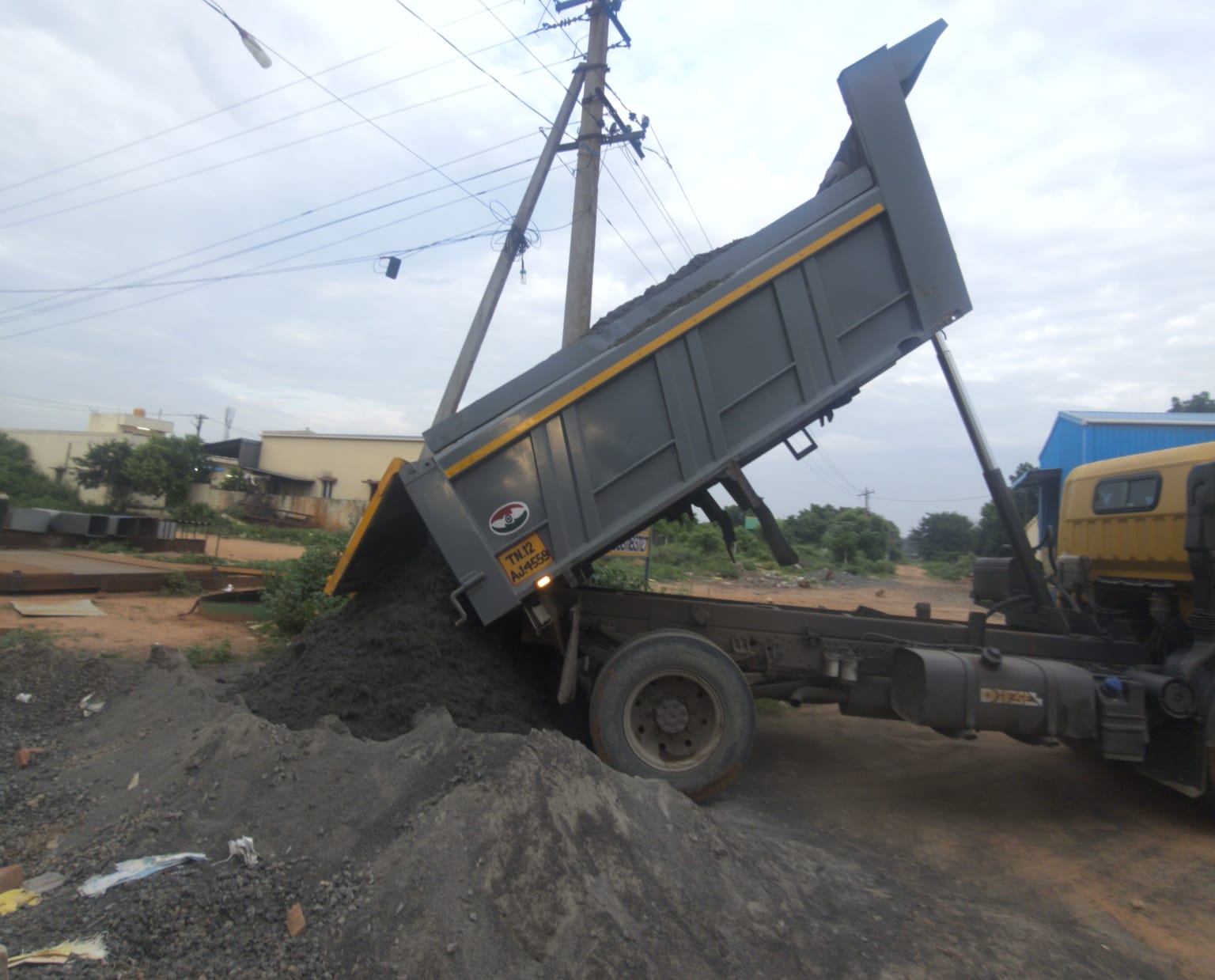 Truck unloading M-sand at a construction site in Chennai